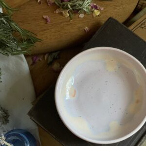 Small pink porcelain dish with pastel purple and yellow color melt glaze